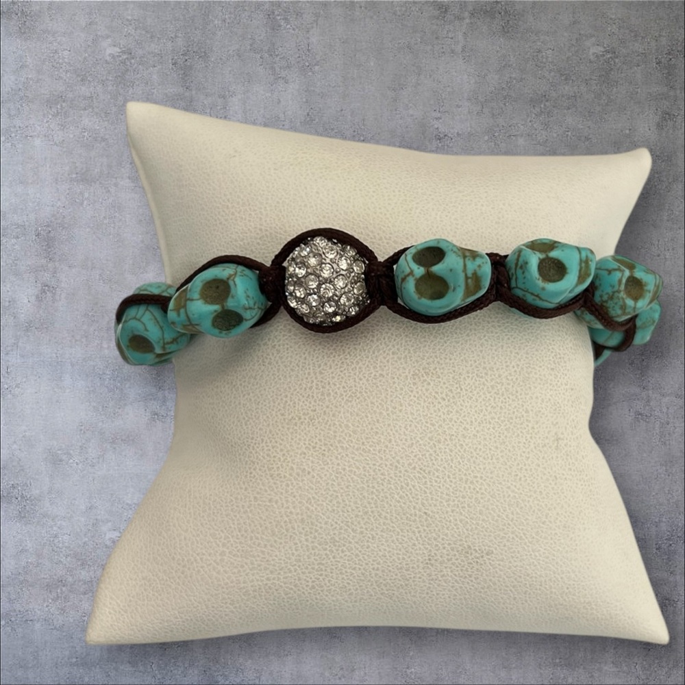 Carved turquoise adjustable bracelet, with round paved charm